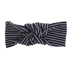 Detail of navy blue and white chevron pattern elastic headband with central twist knot