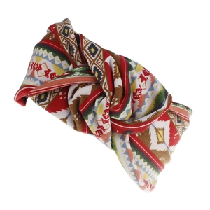 Detail of bohemian knotted headband featuring multi-color geometric ethnic print patterns