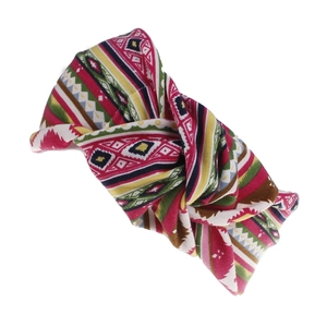 Detail of bohemian floral wide headband with twisted knot design and geometric prints