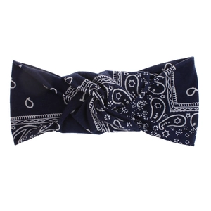 Detail of navy blue Paisley print headband featuring a central knot and bohemian pattern