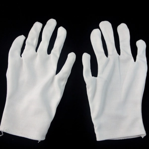 Classic white magician gloves for Halloween performance on black background