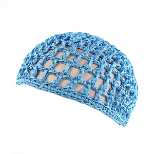Close-up of blue handmade crochet hair net with open mesh pattern on a mannequin head