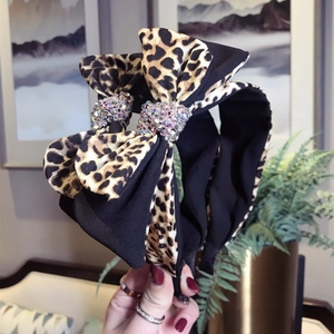 Leopard print headband with double bow and sparkling rhinestone centerpiece