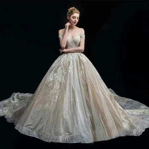 Luxurious off-shoulder ball gown wedding dress with sequins and long train in champagne gold