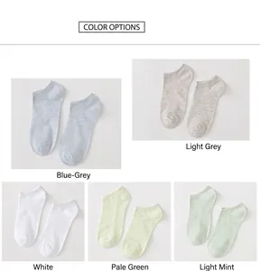 Detail view of cotton boat socks in blue-gray, light gray, white and green shades