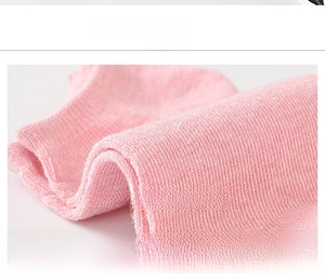 Macro detail of breathable knit texture and soft fabric of pink low-cut cotton socks