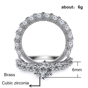 Elegant brass wedding ring set with cubic zirconia and a classic six-prong solitaire