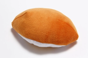 Detail view of the soft short plush texture on the salmon sushi shaped dog squeaky toy