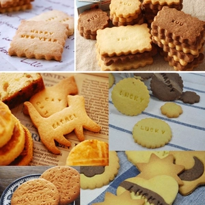 Detail of assorted homemade cookies with stamped letters and cute animal shapes