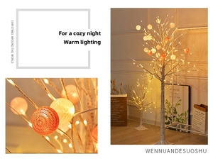 Detail of LED birch tree lamp with warm multi-color cotton ball lights and stable cross base