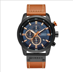 Detailed macro view of the blue textured chronograph dial and brown leather strap