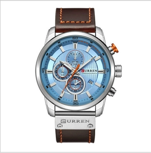 Macro detail of Curren chronograph dial with blue face and silver stainless steel case
