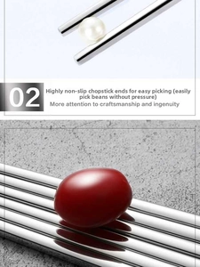 Detail of square 304 stainless steel chopsticks holding round items with anti-slip tips