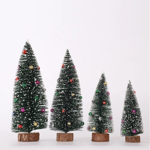 Set of four mini green pine trees with snow and colorful beads on wood bases