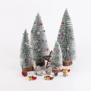 Mini frosted Christmas trees with colorful beads, pine cones, and bells on white background
