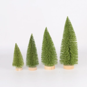 Detailed view of four mini green pine needle Christmas trees with round wooden bases