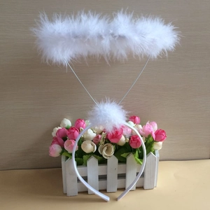 Detail of white feather angel halo headband for festive cosplay and holiday parties
