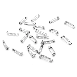 Macro view of silver stainless steel safety pins for DIY jewelry making accessories