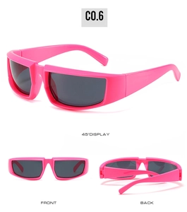 Detail view of pink outdoor sports sunglasses with dark rectangular lenses and wide frames