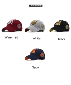 Detail of 3D letter B embroidery and circular patches on cotton baseball caps