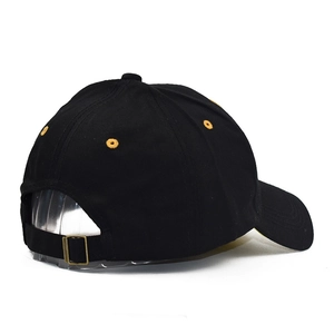 Rear view of black cotton baseball hat with yellow eyelets and adjustable gold buckle