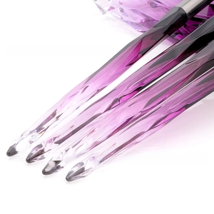 Detail of the purple crystal diamond handle makeup brush with gradient textured design