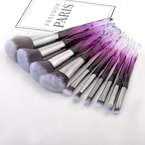 Detailed shot of 10-piece makeup brush set with purple crystal gradient handles