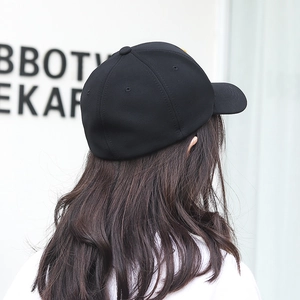 Classic black cotton baseball cap in minimalist six-panel style with curved brim view