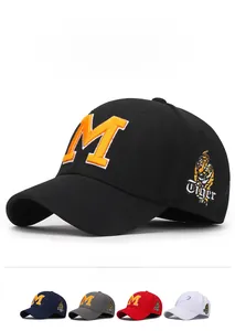 Detail of stretch baseball cap featuring orange embroidered letter M and tiger side patch