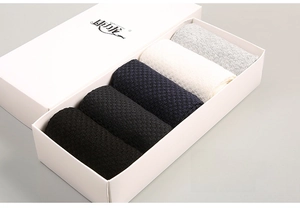 Detailed view of bamboo fiber waffle weave socks in five colors inside a gift box