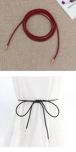Detail of woven thin waist rope with gold metal tips in red and black colors