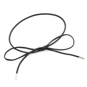 Minimalist black leather waist chain belt with silver tips tied in a bow shape