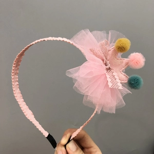 Pink sequin crown headband for girls with colorful pom-poms and tulle decoration