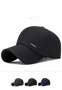 Detail view of plaid texture and metal logo plate on men's sport baseball cap