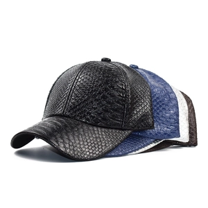 Detailed view of crocodile pattern faux leather baseball caps in multiple colors