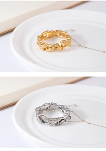 Detailed close-up showing hollow rose and leaf engraving on gold and silver rings