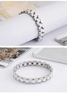 Detailed macro view of steel and white ceramic magnetic bracelet for men