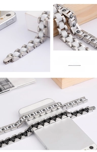 Detail of stainless steel magnetic bracelet with black and white ceramic link inlays