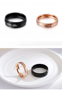 Detail of Her King and His Queen stainless steel couple rings with zircon inlays