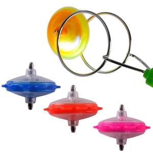 Detail of colorful magnetic gyro toy set with spinning glowing wheel and metal rail handle