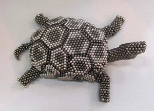 Detail of creative turtle shape assembled from 5mm silver magnetic metal spheres
