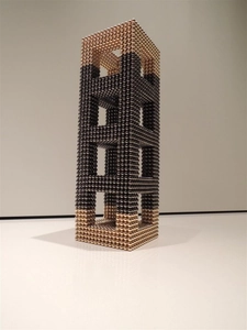 Detail of 5mm magnetic balls in black and gold forming a hollow rectangular structure
