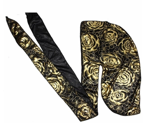 Detailed view of silky black durag with elegant golden floral rose patterns