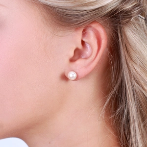 Elegant S925 sterling silver stud earrings featuring round white natural freshwater pearls