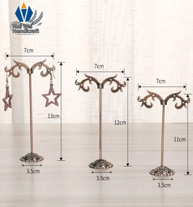 Three-piece bronze metal earring stands set showing various heights and dimensions