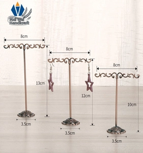 Three-piece bronze metal earring display stands with height dimensions and round bases