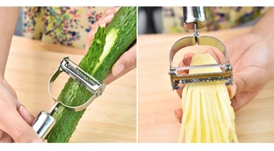 Detailed view of dual-head stainless steel peeler and shredder on a wooden table
