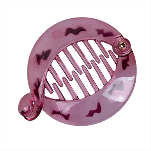 Detail view of purple translucent banana hair clip with spooky bat prints