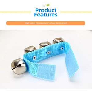 Detail of blue textured strap with four silver metal bells and velcro fastener
