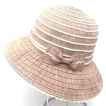 Close-up of brown and beige striped straw hat with delicate side bow and wavy brim